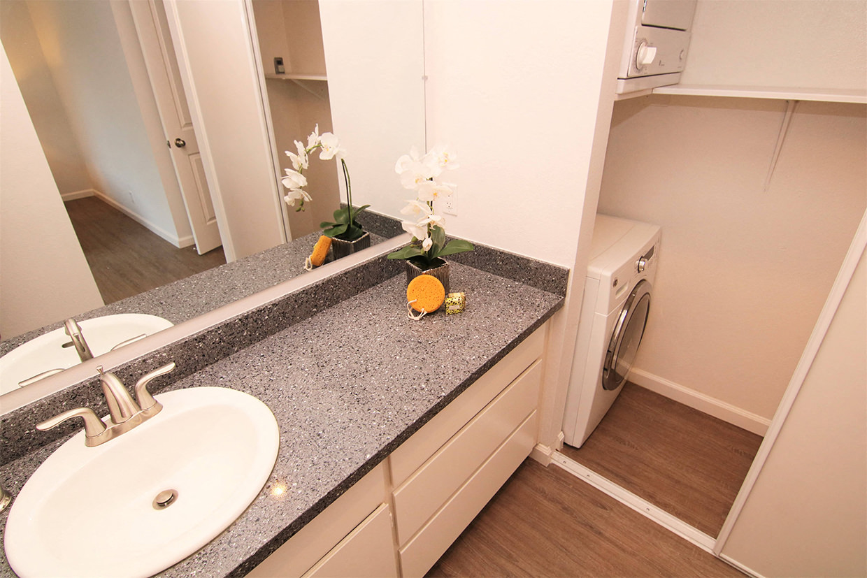 Vanity and stacked washer dryer layout